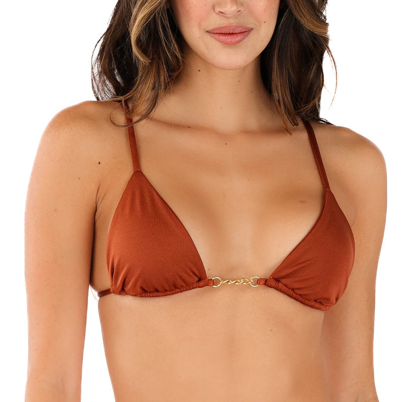 A woman in the Sienna Triangle Bikini Top, crafted from luxurious fabric with thin straps and a small central metallic detail, elegantly contrasted against the plain white background.